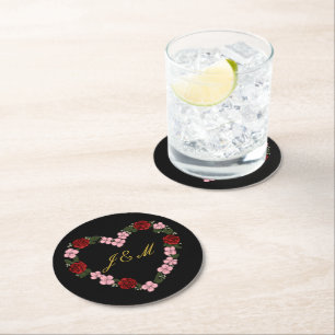 Black coasters with a pink and red heart