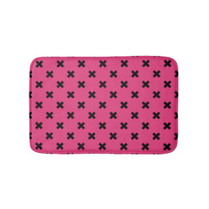 Black cross stitches on fuchsia bath mat