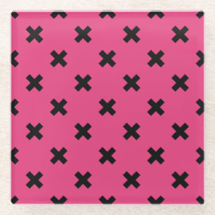 Black cross stitches on fuchsia glass coaster