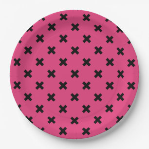 Black cross stitches on fuchsia paper plate