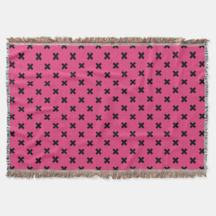 Black cross stitches on fuchsia throw blanket