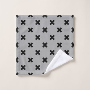 Black cross stitches on grey wash cloth