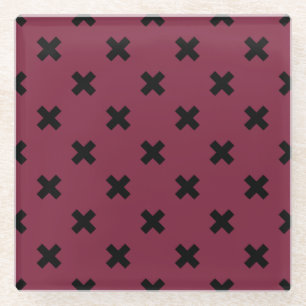Black cross stitches on mulberry glass coaster