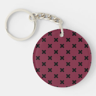 Black cross stitches on mulberry keychain