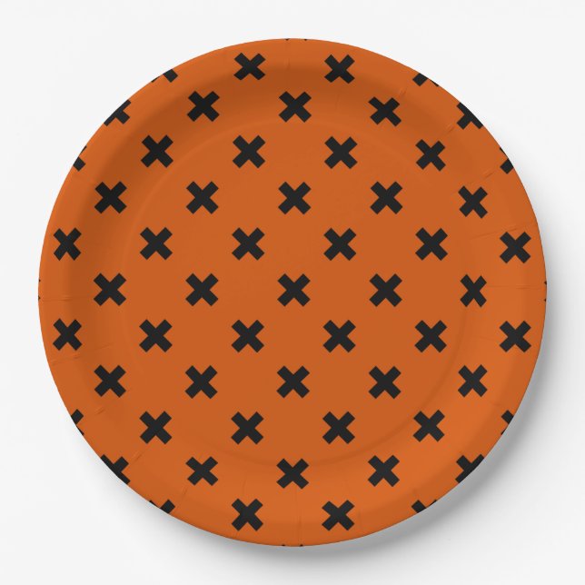 Black cross stitches on orange paper plate (Front)