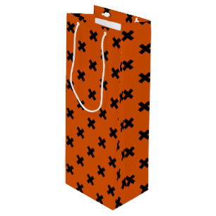 Black cross stitches on orange wine gift bag