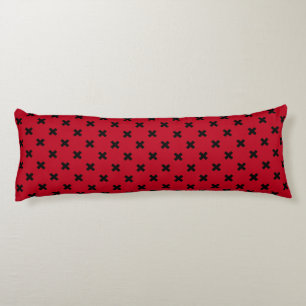 Black cross stitches on red body pillow