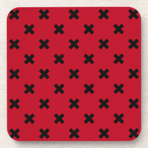 Black cross stitches on red coaster