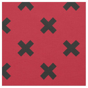 Black cross stitches on red fabric