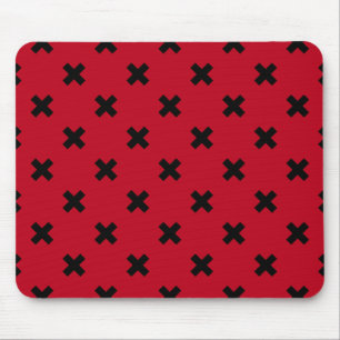 Black cross stitches on red mouse pad