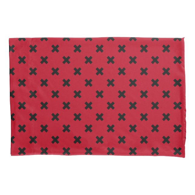Black cross stitches on red pillowcase (Front)