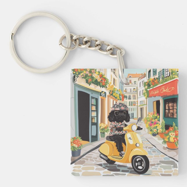 Black Doodle Riding Scooter European City Streets Keychain (Front)