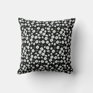 Black floral throw pillow with white flowers