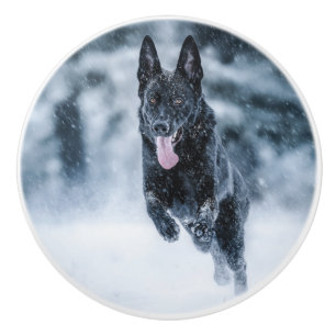 Black German Shepherd in snow Duvet Cover Ceramic Knob