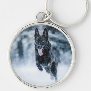 Black German Shepherd in snow Duvet Cover Keychain