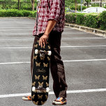 Black gold butterflies pattern name script skateboard<br><div class="desc">A black background decorated with golden butterflies.  Personalize and add your name.</div>