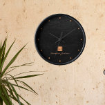 Black gold elegant monogram name personalized round clock<br><div class="desc">Luxury monogrammed round wall clock with a black leather look background and a faux gold copper metallic brushed square with elegant script signature name and monogram initials. Easy to personalize with your business or personal initials and name. Could be an elegant personalized gift for business or any other occasion, personal...</div>