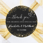 Black gold heart wedding thank you classic round sticker<br><div class="desc">A stylish black background decorated with faux gold glitter,  sparkles.  Personalize and add your names and wedding date. With the text: Thank you for sharing our special day.</div>