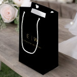 Black Gold Modern Minimalist Monogram Name Small Gift Bag<br><div class="desc">Present your gifts in style with our Black and Gold Modern Minimalist Monogram Name Gift Bag. This elegant bag boasts a clean and contemporary design, featuring a customizable monogram that adds a personalized touch to your gift-giving. Crafted with quality in mind, this bag is both sophisticated and minimalist, making it...</div>