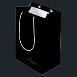 Black Gold Modern Script Girly Monogram Name Medium Gift Bag<br><div class="desc">Black and Gold Simple Script Monogram Name Gift Bag. This makes the perfect sweet 16 birthday,  wedding,  bridal shower,  anniversary,  baby shower or bachelorette party gift bag for someone that loves glam luxury and chic styles.</div>