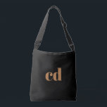 Black gold monogram initials elegant modern crossbody bag<br><div class="desc">A classic chic black background. Personalize and add your monogram initials written with golden block letters. Modern,  trendy and simple.</div>