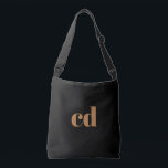 Black gold monogram initials elegant modern crossbody bag<br><div class="desc">A classic chic black background. Personalize and add your monogram initials written with golden block letters. Modern, trendy and simple.</div>