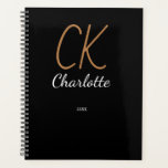 Black gold monogram initials name 2025 planner<br><div class="desc">Plan your year in style with the "Black Gold Monogram 2025 Planner." Featuring a luxurious black and gold design, this planner is as practical as it is elegant. The customizable monogram detail adds a personal touch, making it perfect for staying organized while showcasing your unique style. This planner includes easy-to-navigate...</div>
