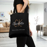 Black gold monogram name initials script tote bag<br><div class="desc">Personalize and add your first name,  monogram initial and full name.  Black background,  white and golden coloured text. The name is written with a modern hand lettered style script.</div>
