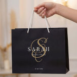 Black Gold Monogram Personalized Bridesmaid Large Gift Bag<br><div class="desc">This black personalized bridesmaid gift bag features personalized bridesmaid's name,  calligraphy monogram in gold colour and wedding date. Change background and fonts colours easily if you like.</div>