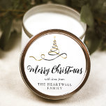 Black Gold Ribbon Tree Merry Christmas Script Classic Round Sticker<br><div class="desc">This modern holiday sticker features a black and gold faux foil ribbon Christmas tree sprinkled with gold faux glitter,  and the words "Merry Christmas" in stylish black calligraphy script. Personalize it with your family's name in serif font.</div>