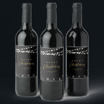 Black & Gold String Lights Snow Merry Christmas Wine Label<br><div class="desc">Celebrate the season with this stylish custom Christmas wine label. This label design features "Merry Christmas" text and a festive snowflake and string lights background. You can personalize the text. More holiday stationery and party supplies are available at my shop BaraBomDesign.</div>