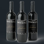 Black & Gold String Lights Snow Merry Christmas Wine Label<br><div class="desc">Celebrate the season with this stylish custom Christmas wine label. This label design features "Merry Christmas" text and a festive snowflake and string lights background. You can personalize the text. More holiday stationery and party supplies are available at my shop BaraBomDesign.</div>