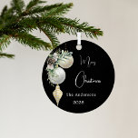 Black gold white baubles Christmas Metal Ornament<br><div class="desc">An elegant,  modern black background. Decorated with white and gold baubles and some greenery and a pine cone.  Personalize and add your name,  year.  Text: Merry Christmas</div>