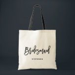 Black Hand Lettering Bridesmaid I Personalized Tote Bag<br><div class="desc">Customizable bridesmaid tote bag. Modern and classic tote bag featuring black "bridesmaid" hand lettering script. Personalize by adding the receiver's name,  the hashtag of the wedding or other details. Perfect as a gift for your wedding party or bridal party.</div>