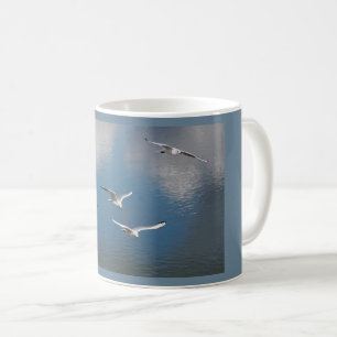 Black-headed gulls in flight   coffee mug