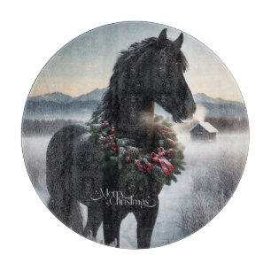 Black horse in the snow with Christmas wreath Cutting Board