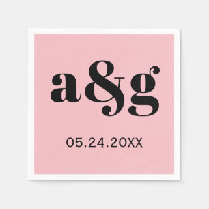 Black initials typography on pink wedding napkin
