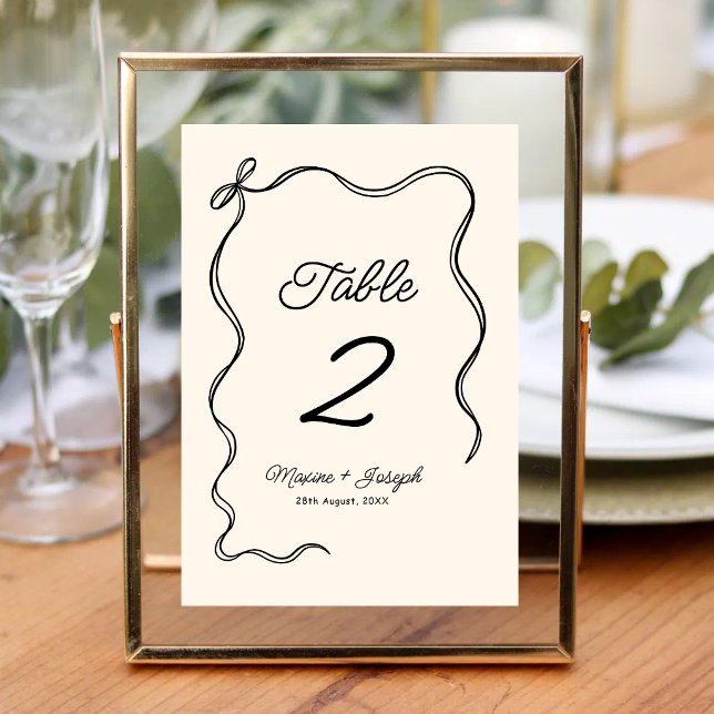 Black & Ivory Hand Drawn Bow Ribbon Sketch Wedding Table Number (Black and ivory bow ribbon wedding table number adds elegant style and effortless seating.)
