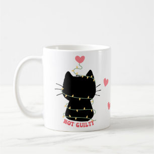 Black kitten not guilty of tangling with lights coffee mug