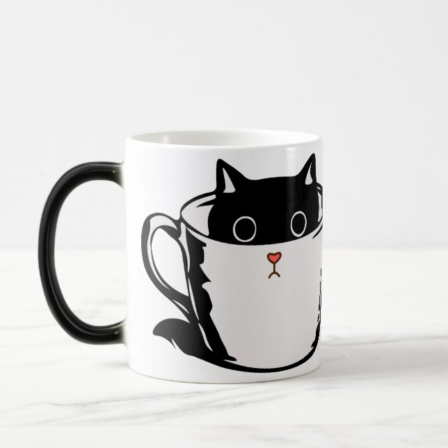 Black kitten with red nose hiding in a cup (Left)