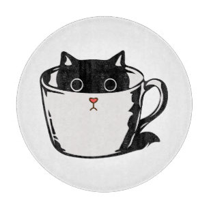 Black kitten with red nose hiding in a cup cutting board