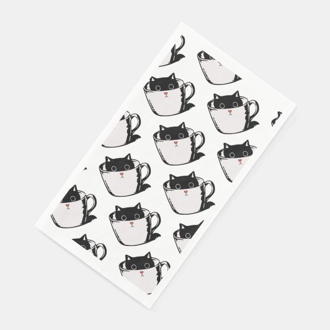 Black kitten with red nose hiding in a cup napkin (Corner)