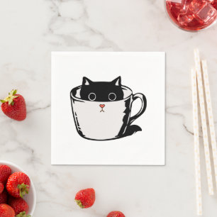 Black kitten with red nose hiding in a cup napkin