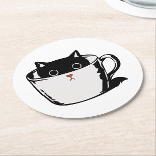 Black kitten with red nose hiding in a cup round paper coaster