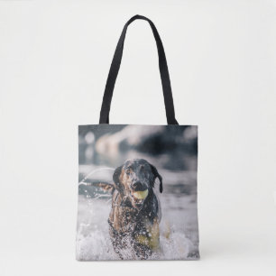 Black Labrador Plays Fetch In Water Tote Bag
