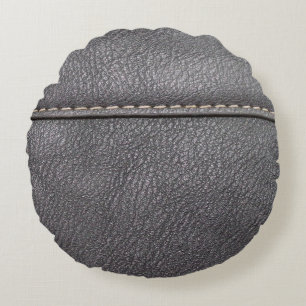 Black leather stitched with white stitching round pillow