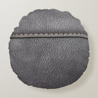 Black leather stitched with white stitching round pillow