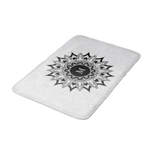 Black mandala on a white paisley bath mat