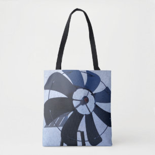 black metal blades of a garden wind mill on a tote bag
