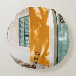 Black metal chair near dor round pillow